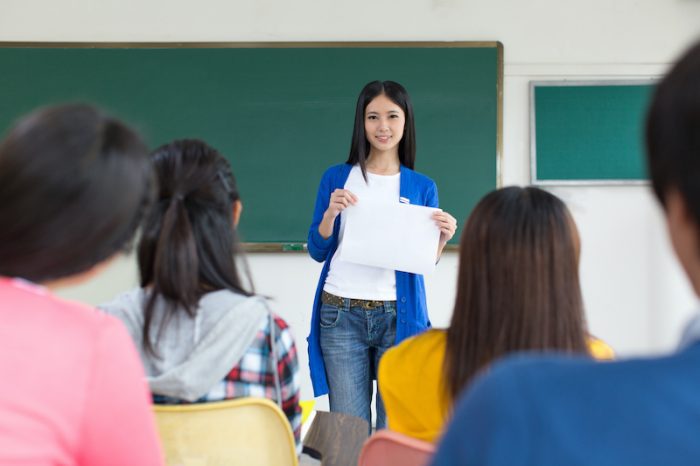College teacher and students in the classroom College teacher and students in the classroom